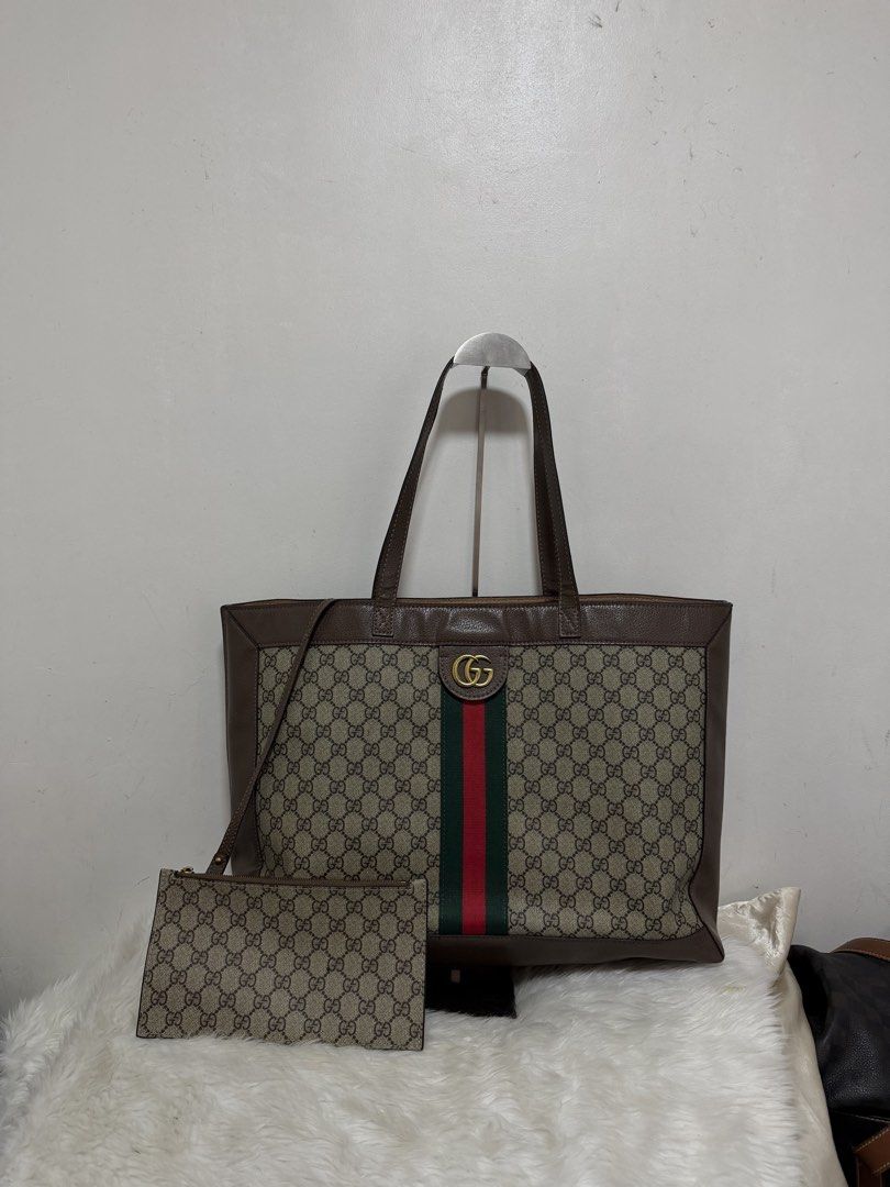 GG OPHIDIA LARGE TOTE BAG (Category: Luxury Bags & Wallets) located in Paranaque City. Submitted by glendalecollection (Listing ID 1464626742, Image 1). Description: - beige - with small pouch - GG Supreme canvas - signature Web stripe.