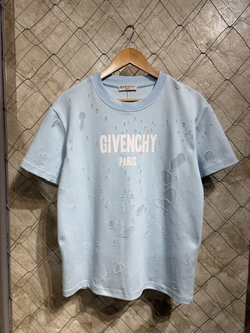 Givenchy Paris Distressed Light Blue T-Shirt (Category: Tshirts & Polo Shirts ) located in Manila. Submitted by ardobe.mnl (Listing ID 1464747737, Image 1). Description: Givenchy Script Logo Destroyed Tee. Size: Medium Dimes: 20x26 Condition: Excellent Flaw: Check last photo! Dm for inquiries!.