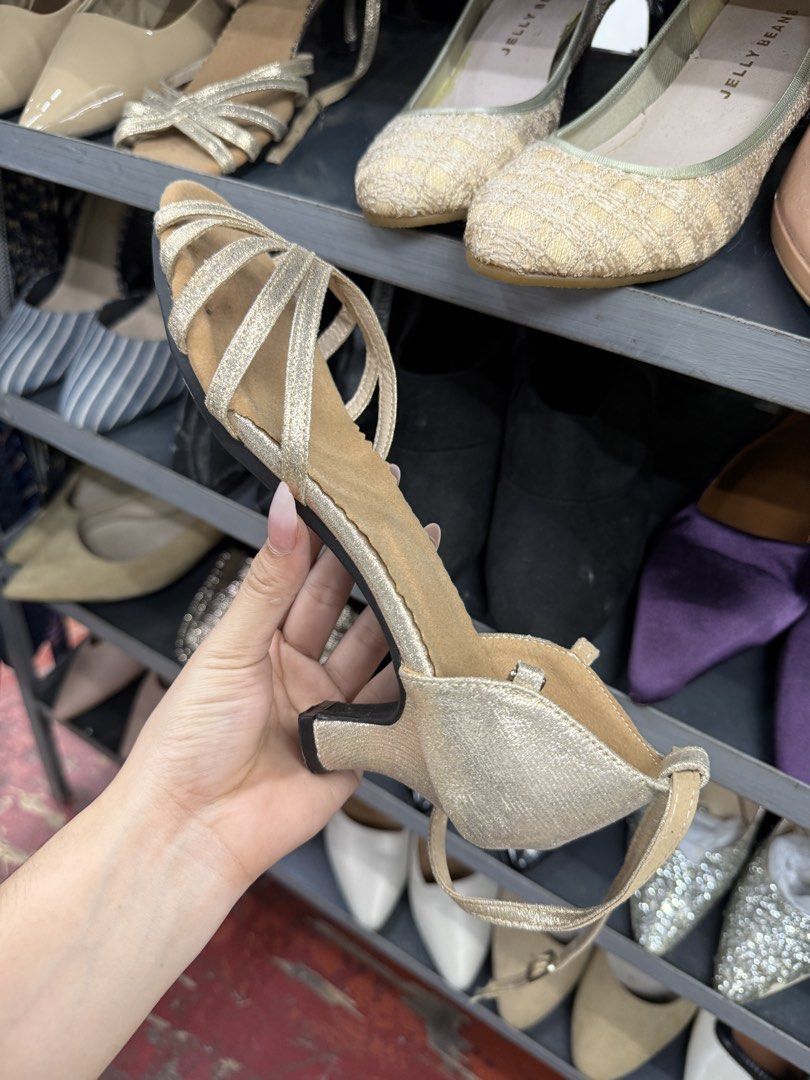 Gold Glitter Strap Dance Heels Size 39 (Category: Heels) located in Manila. Submitted by fastlion.584bdf (Listing ID 1464736556, Image 1). Description: - Item: Gold sparkly dance heels - Size: 39 (sticker on bottom) - Design: Strappy front with secure ankle strap - Heel & Sole: Comfortable mid heel with rubber grip sole underneath - Condition: Clean, hardly worn.