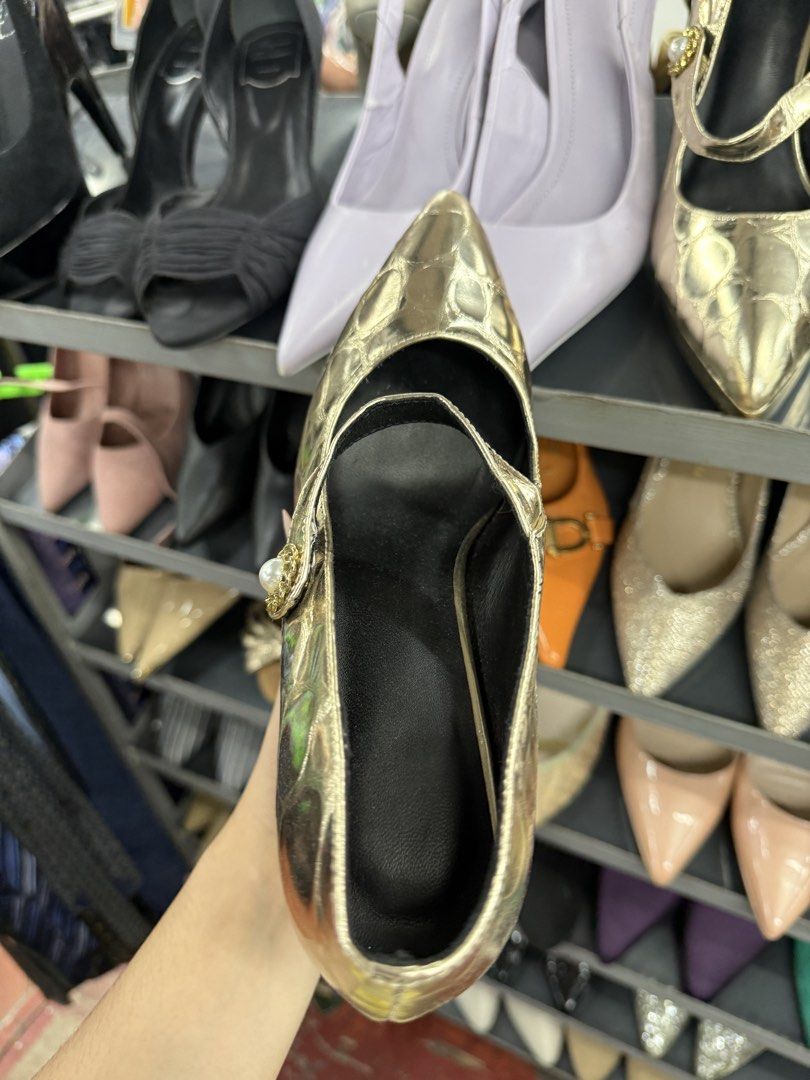 Gold Metallic Mary Jane Pumps with Pearl Strap Button (Category: Heels) located in Manila. Submitted by fastlion.584bdf (Listing ID 1464737862, Image 2). Description: Gold metallic heels with an embossed pattern across the upper. Mary Jane strap featuring a decorative button with a central pearl accent. Pointed toe design and high block heel with a shiny metallic finish. Sole shows standard size marking of 240(1.5)..