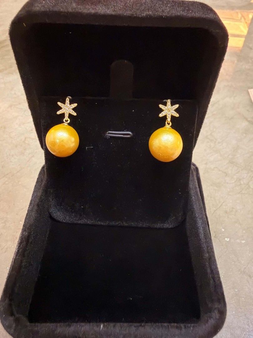 Gold Pearl Star Earrings with Crystals (Category: Earrings) located in Santa Rosa. Submitted by jfaguilar19 (Listing ID 1464618862, Image 1). Description: - Cute gold pearl earrings - Adorable star tops with small crystals - Warm, golden pearl color - Includes a black velvet jewelry box - Perfect for dressing up any outfit 100% Authentic South Sea Pearl.