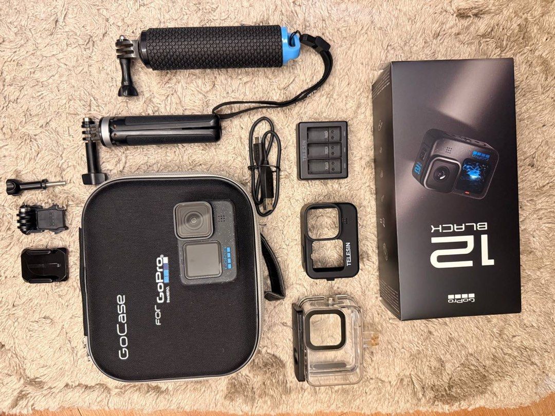 GoPro HERO 12 Black Action Camera with Accessories (Category: Cameras) located in Manila. Submitted by muggy2019 (Listing ID 1464617518, Image 2). Description: - GoPro HERO 12 Black camera - GoCase protective case - Telesin protective housing - Dual battery charger with cable - Grip handle - Various mounts included - Original box.
