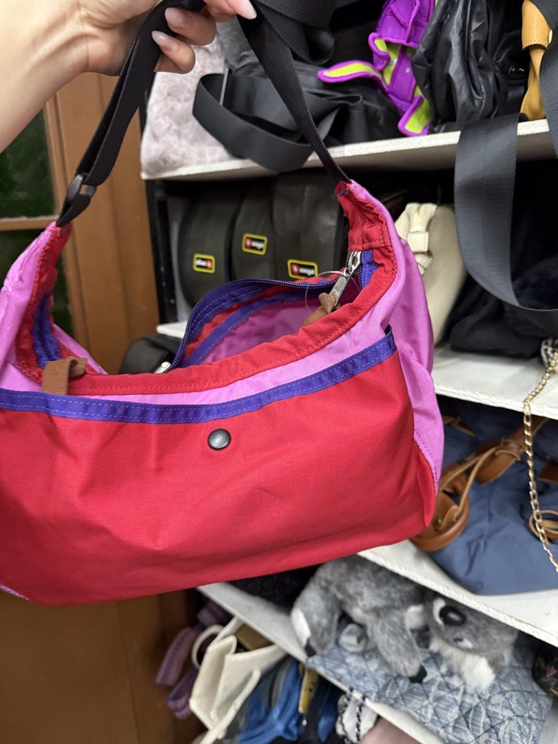 Gregory Multi-color Shoulder Bag Pink Red Purple (Category: Shoulder Bags) located in Manila. Submitted by fastlion.584bdf (Listing ID 1464739670, Image 3). Description: - Brand: Gregory - Design: Eye-catching red, pink, and purple color block - Compartments: Spacious main zip compartment with pink lining and front pocket with snap button closure - Details: Leather zipper pull tabs and adjustable black strap with buckle - Material: Sturdy, durabl