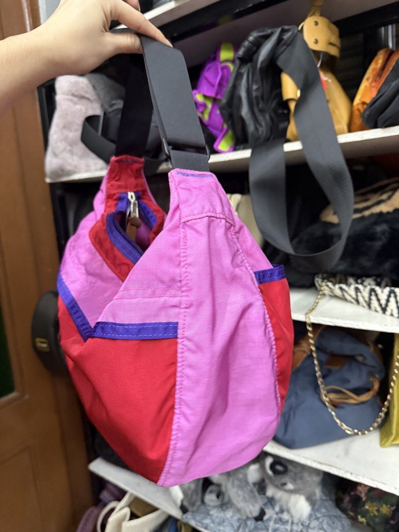 Gregory Multi-color Shoulder Bag Pink Red Purple (Category: Shoulder Bags) located in Manila. Submitted by fastlion.584bdf (Listing ID 1464739670, Image 2). Description: - Brand: Gregory - Design: Eye-catching red, pink, and purple color block - Compartments: Spacious main zip compartment with pink lining and front pocket with snap button closure - Details: Leather zipper pull tabs and adjustable black strap with buckle - Material: Sturdy, durabl