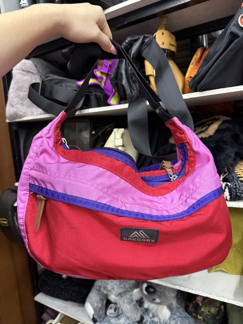 Gregory Multi-color Shoulder Bag Pink Red Purple (Category: Shoulder Bags) located in Manila. Submitted by fastlion.584bdf (Listing ID 1464739670, Image 1). Description: - Brand: Gregory - Design: Eye-catching red, pink, and purple color block - Compartments: Spacious main zip compartment with pink lining and front pocket with snap button closure - Details: Leather zipper pull tabs and adjustable black strap with buckle - Material: Sturdy, durabl