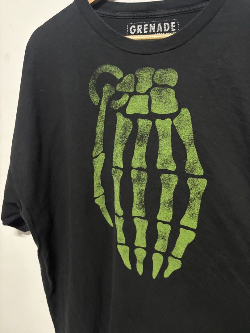 Grenade Skeleton Hand Grenade Graphic T-Shirt (Category: Tshirts & Polo Shirts ) located in Manila. Submitted by skeletal_v2 (Listing ID 1464719869, Image 2). Description: GRENADE (JESSE PINKMAN) 3500+SF 26/31 GOOD CONDITION COLOR RATE 9/10 - Brand: Grenade - Size: XXL (Relaxed fit) - Color: Black with green skeleton hand grenade graphic - Pop Culture: Famous piece worn by Jesse Pinkman in Breaking Bad - Condition: Minor fading on fabric, graphic