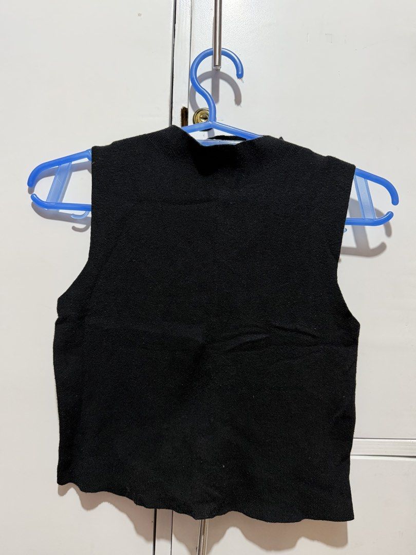 Grey & Black Sleeveless Knit Tops (Category: Sleeveless) located in Valenzuela. Submitted by sophysabelaa (Listing ID 1464621810, Image 2). Description: - Set of two sleeveless knit tops (take all for 500) - One grey top with ribbed neckline and armholes - One black top with a mock neck - Both tops are cropped length - Ideal for layering or wearing on their own - Versatile additions to any wardrobe.