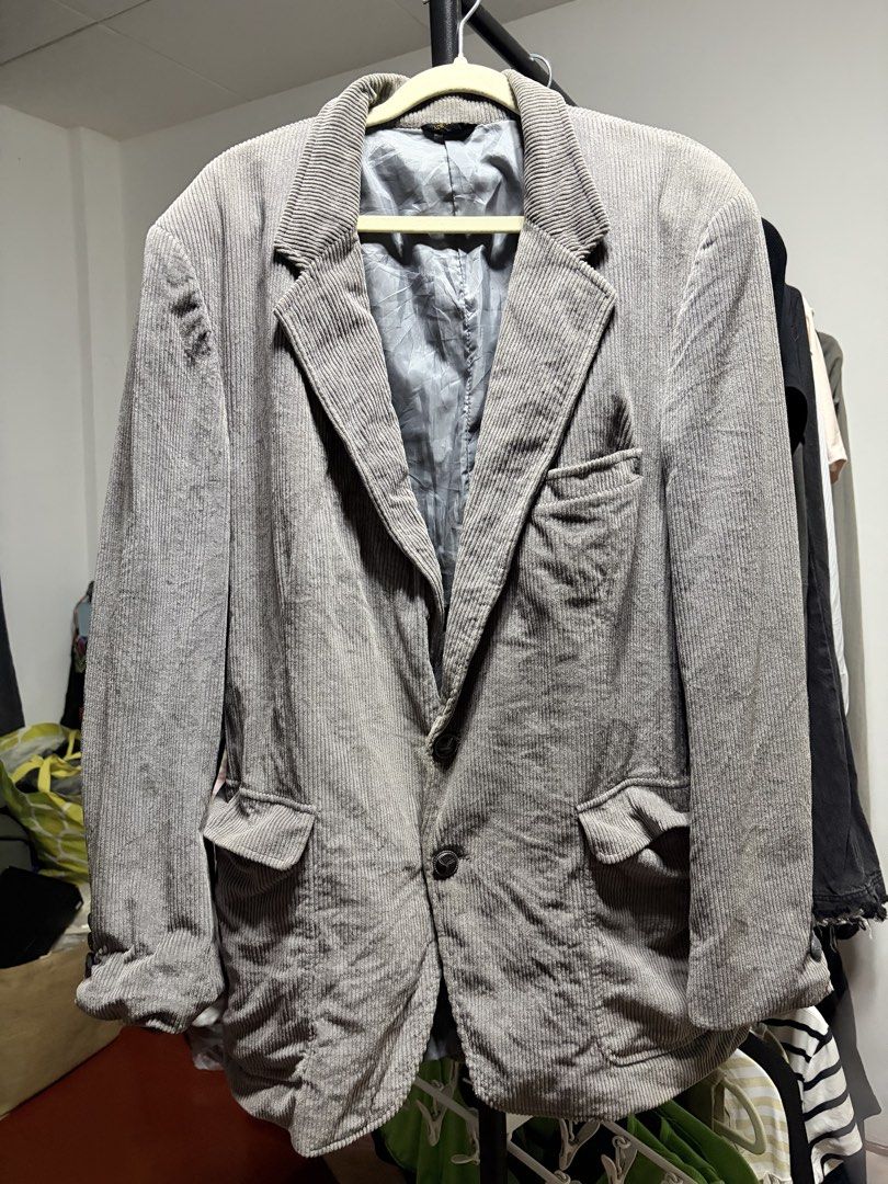 Grey Corduroy Blazer Jacket (Category: Coats, Jackets and Outerwear) located in Manila. Submitted by finderskeepersmnl_092026 (Listing ID 1464744958, Image 1). Description: - Style: Classic fit grey corduroy blazer - Design: Notched lapels and front button closure - Lining: Fully lined with matching grey fabric - Pockets: One chest pocket and two front flap pockets - Details: Structured shoulders for a sharp silhouette - Best for: Cooler weather 