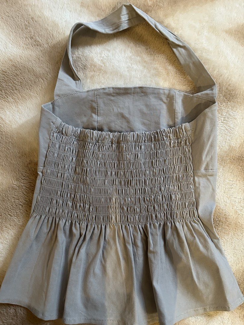 Grey Halter Neck Peplum Top (Category: Sleeveless) located in Manila. Submitted by __nicscloset (Listing ID 1464696072, Image 2). Description: Color: Grey Halter neck peplum top with smocked back Size Xs-S .