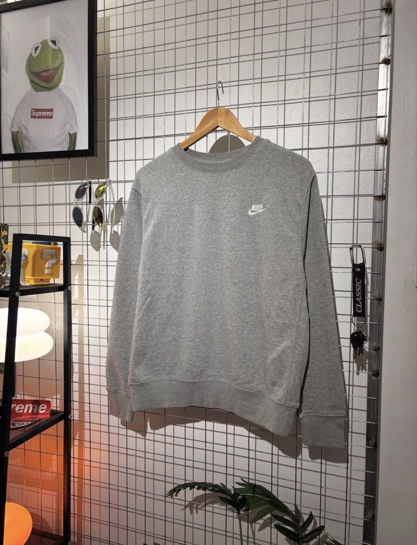 Grey Nike Crewneck Sweatshirt (Category: Coats, Jackets and Outerwear) located in Cavite. Submitted by vlblgrmnts_ (Listing ID 1464643638, Image 2). Description: - Classic grey Nike sweatshirt - Simple and clean design - Small embroidered Nike logo on the chest - Comfortable and versatile for everyday wear - Great for layering or wearing solo - Easily pairs with jeans or shorts 22x25 Best fit meduim 800.
