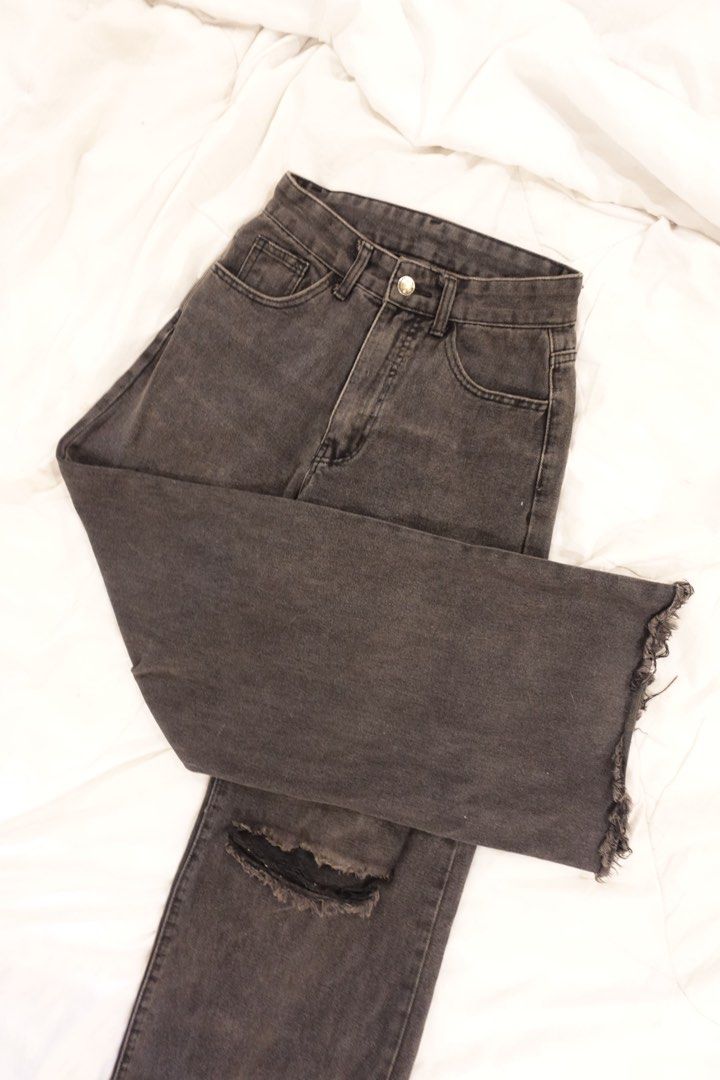 Grey Ripped Wide Leg Jeans (Category: Jeans) located in Pasig City. Submitted by hulyascloset (Listing ID 1464621904, Image 2). Description: - Grey wide leg jeans - Ripped details on the knees - Frayed hem - Button and zip closure - Front and back pockets - Comfortable fit - Ideal for casual wear RFS definitely now a medium.