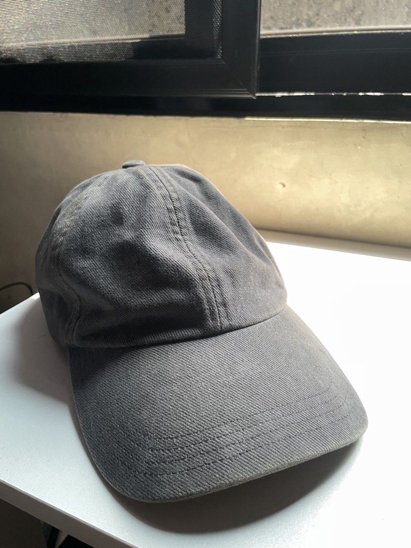 GU charcoal gray twill cap (Category: Caps & Hats) located in Caloocan City. Submitted by iannacino (Listing ID 1464606775, Image 1). Description: GU charcoal gray twill cap color rate: 7/10 issue: discoloration/fade lines 180 +sf.