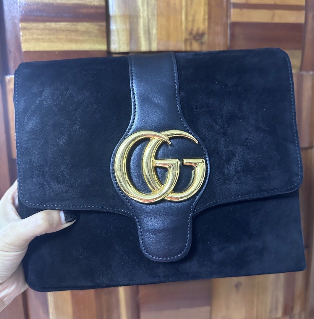 Gucci Black Suede Marmont Sling Bag (Category: Luxury Bags & Wallets) located in General Trias. Submitted by mimispreloves (Listing ID 1464604611, Image 1). Description: - Black suede clutch with leather trim - Iconic gold GG logo hardware - Ideal for evening wear or as a statement piece - Spacious interior for essentials - Clean interior - Comes with original dust bag.