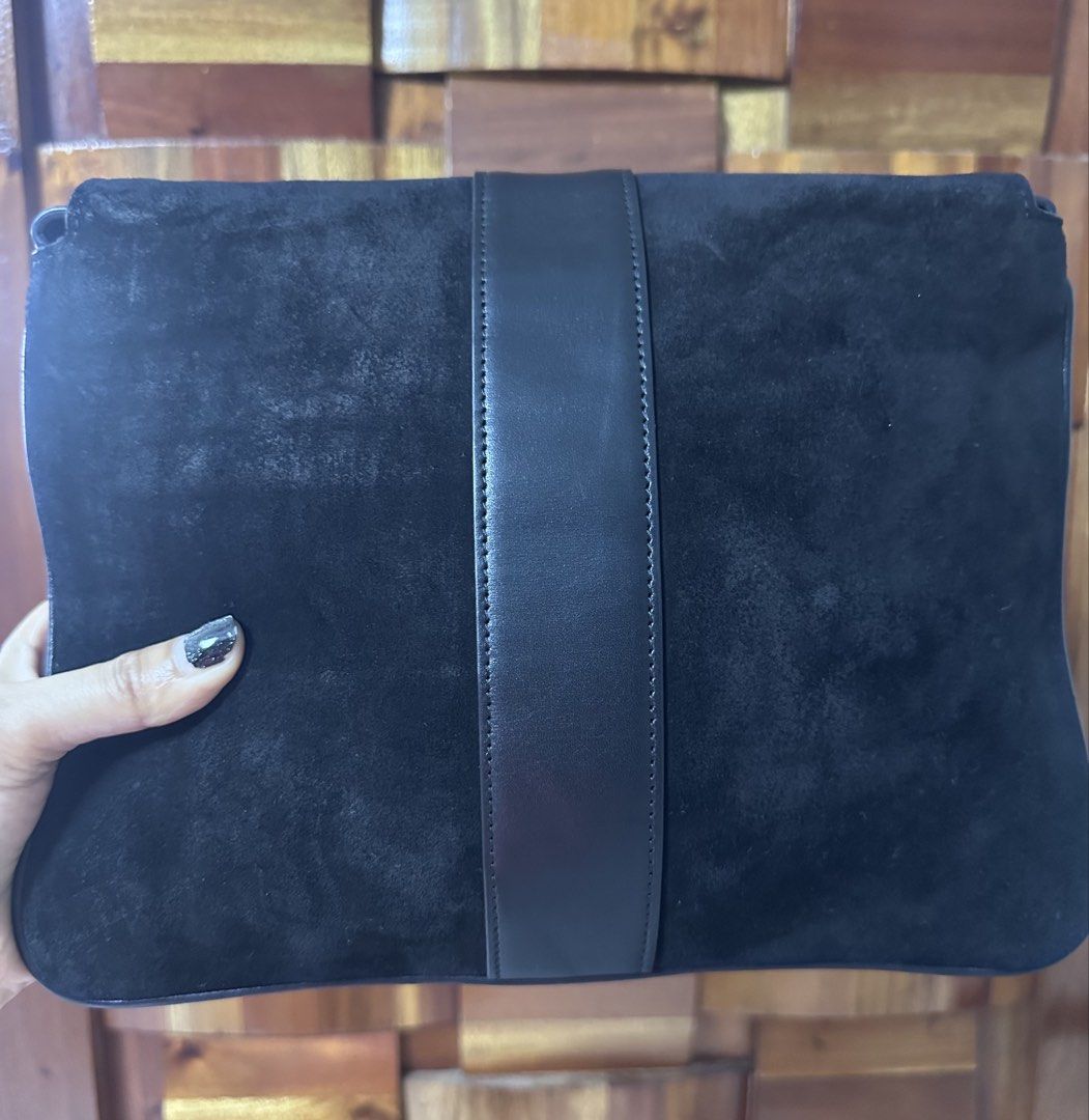Gucci Black Suede Marmont Sling Bag (Category: Luxury Bags & Wallets) located in General Trias. Submitted by mimispreloves (Listing ID 1464604611, Image 2). Description: - Black suede clutch with leather trim - Iconic gold GG logo hardware - Ideal for evening wear or as a statement piece - Spacious interior for essentials - Clean interior - Comes with original dust bag.