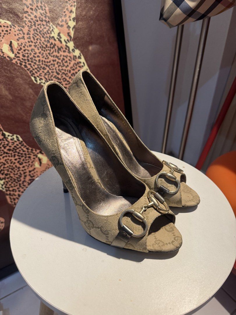 Gucci Canvas Horsebit Peep-Toe Heels (Category: Heels) located in Tuguegarao City. Submitted by shoppingaccgalore (Listing ID 1464634253, Image 2). Description: - Authentic Gucci canvas heels - Iconic horsebit detail - Peep-toe style - Size: 36 1/2 - Made in Italy - Classic, versatile design - Moderate heel height.