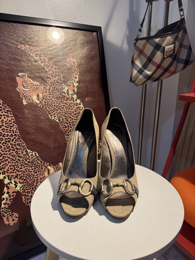 Gucci Canvas Horsebit Peep-Toe Heels (Category: Heels) located in Tuguegarao City. Submitted by shoppingaccgalore (Listing ID 1464634253, Image 1). Description: - Authentic Gucci canvas heels - Iconic horsebit detail - Peep-toe style - Size: 36 1/2 - Made in Italy - Classic, versatile design - Moderate heel height.