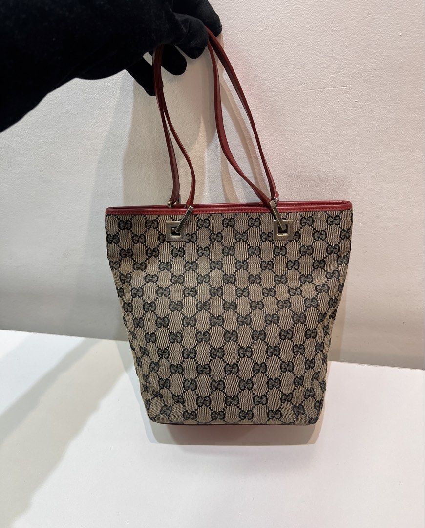 Gucci Canvas Tote Bag (Category: Luxury Bags & Wallets) located in Cebu City. Submitted by brandedcorner_ph (Listing ID 1464731858, Image 2). Description: Pre-loved ((G))ucci Canvas Tote Bag 100% Authentic or money back Condition • Excellent condition • No flaws Product Details •Color: Maroon •Hardware: Silver tone •Material: Canvas & leather •Approximate Dimensions in inches: H9.5 x W11 x D3.5 Color may vary due to lighting. PM for more photos �