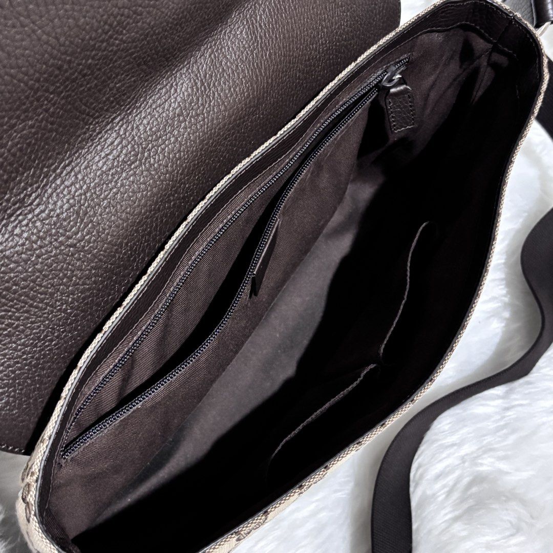 Gucci GG Canvas Flap Messenger Bag (Category: Luxury Bags & Wallets) located in Quezon City. Submitted by leens.preloved (Listing ID 1462629066, Image 3). Description: - Classic Gucci messenger bag - Iconic GG monogram pattern - Durable canvas with leather trim - Adjustable black strap - Ideal for everyday use - Price: PHP 37,000.