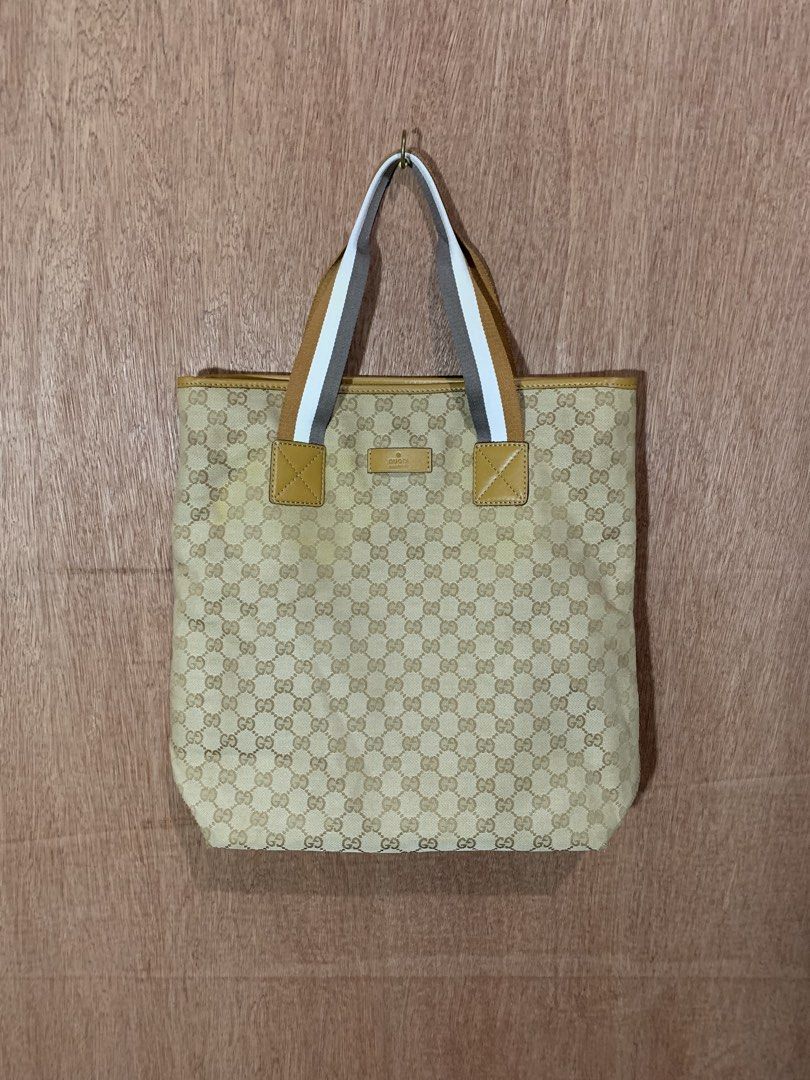 Gucci GG Monogram Canvas Tote Bag (Category: Luxury Bags & Wallets) located in Tacurong. Submitted by ljsthrift (Listing ID 1464580632, Image 1). Description: - Gucci two way bag - Beige GG monogram canvas with tan leather trim - Iconic Gucci logo plaque - Straps with stripe detail - Versatile: can be worn as a shoulder bag or tote - Ideal for everyday use.