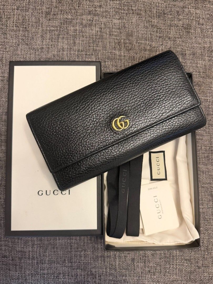 Gucci Marmont Black Leather Long Wallet (Category: Luxury Bags & Wallets) located in Tagaytay City. Submitted by SibsDeclutter4ever (Listing ID 1464589306, Image 1). Description: GUCCI Black Leather Long Wallet 🖤 Authentic Gucci long wallet ✨ Black textured leather ✨ Gold Interlocking G logo ✨ Complete with original box, dust bag & cards ✨ Very good condition / well kept ✨ Elegant and timeless design 💰 Selling Price: ₱15000 📍 Silang, Cavite 🚚