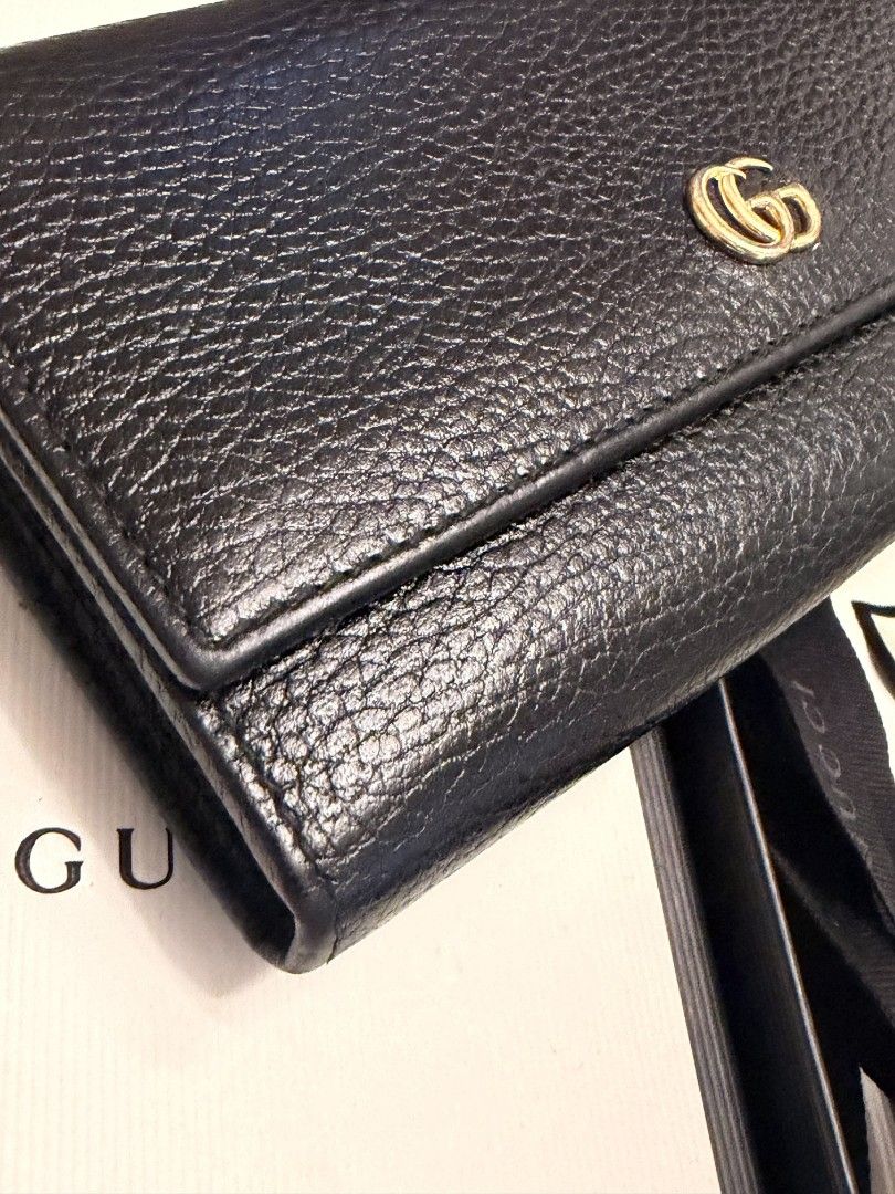 Gucci Marmont Black Leather Long Wallet (Category: Luxury Bags & Wallets) located in Tagaytay City. Submitted by SibsDeclutter4ever (Listing ID 1464589306, Image 2). Description: GUCCI Black Leather Long Wallet 🖤 Authentic Gucci long wallet ✨ Black textured leather ✨ Gold Interlocking G logo ✨ Complete with original box, dust bag & cards ✨ Very good condition / well kept ✨ Elegant and timeless design 💰 Selling Price: ₱15000 📍 Silang, Cavite 🚚