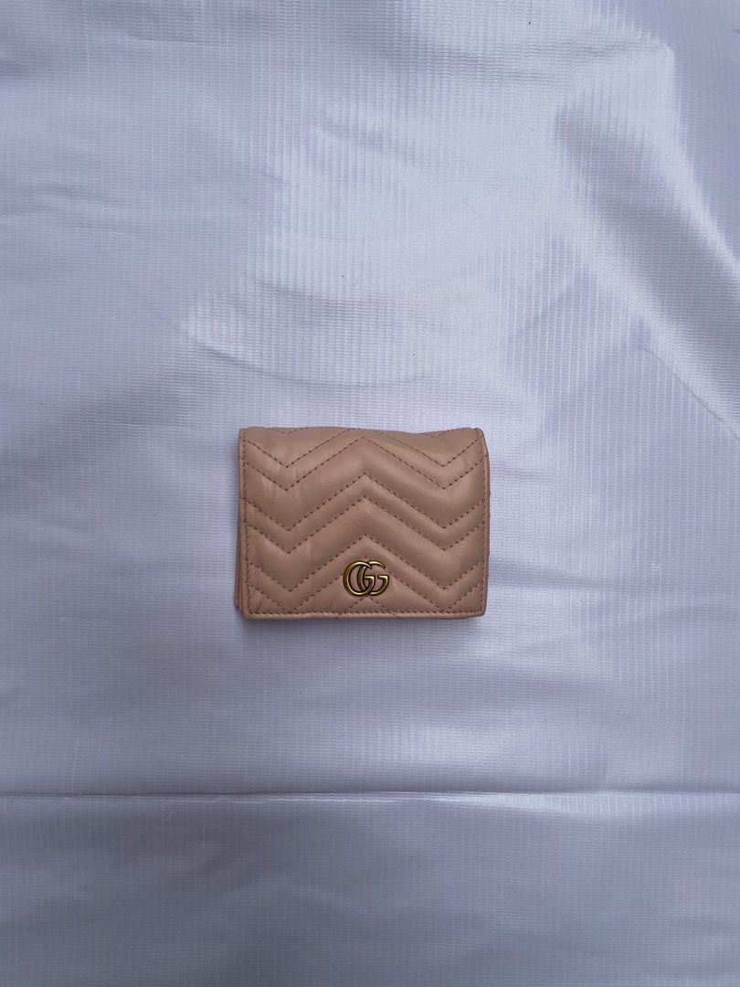 GUCCI Marmont Card Case Wallet (Category: Luxury Bags & Wallets) located in Manila. Submitted by prelovedbyykykyy (Listing ID 1464728434, Image 1). Description: WTS! - Ⓖⓤⓒⓒⓘ Marmont Card Case Wallet Brand New Condition Legit/Authentic Money back guarantee Details: Pink beige matelassé chevron nappa leather Light gold-toned hardware Tonal fabric lining Double G Inside: 5 card slots, open pocket, 1 zipper pocket, 1 bill compartment Snap button clos