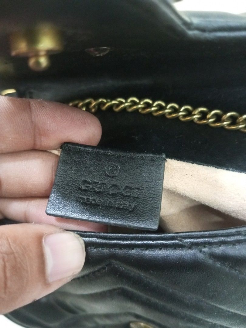 Gucci Marmont Small Shoulder Bag Black Leather (Category: Luxury Bags & Wallets) located in Bacolod City. Submitted by exequelgra46775 (Listing ID 1464649455, Image 3). Description: - Gucci Marmont Bag - Color: Black - Material: Quilted Leather - Hardware: Gold GG Logo and Chain Strap - Origin: Made in Italy - Serial Numbers: 476433 167732 and 264397 - Versatile: Ideal for nights out or everyday use.