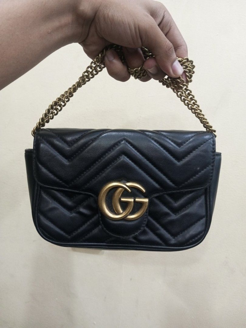 Gucci Marmont Small Shoulder Bag Black Leather (Category: Luxury Bags & Wallets) located in Bacolod City. Submitted by exequelgra46775 (Listing ID 1464649455, Image 1). Description: - Gucci Marmont Bag - Color: Black - Material: Quilted Leather - Hardware: Gold GG Logo and Chain Strap - Origin: Made in Italy - Serial Numbers: 476433 167732 and 264397 - Versatile: Ideal for nights out or everyday use.