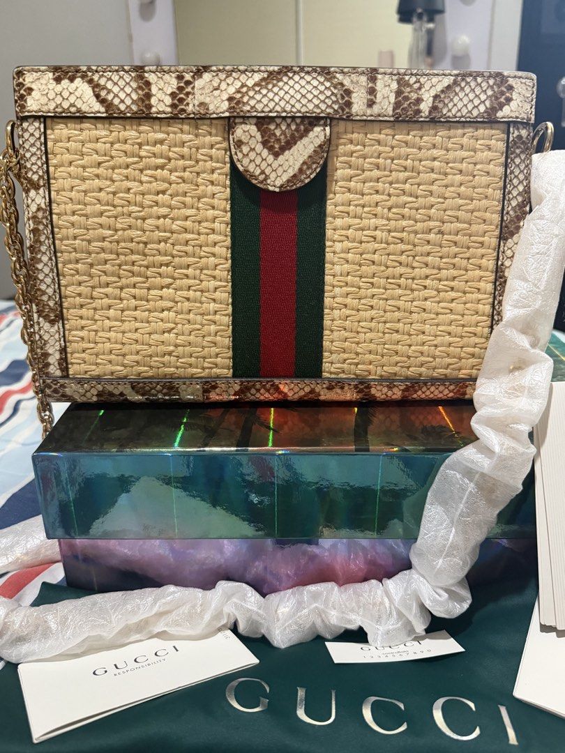 GUCCI RAFFIA ELAHPHE GG OPHIDIA (Category: Shoulder Bags) located in Taguig. Submitted by Zyannah (Listing ID 1464614632, Image 2). Description: GUCCI RAFFIA ELAHPHE GG OPHIDIA CHAIN SHOULDER BAG Brand new / UNUSED 💯 • Woven raffia body • Textured Elaphe (snake leather) trim • Signature green & red Web stripe • Classic GG motif • Elegant gold-tone hardware • Stylish chain shoulder strap • Complete inclusions • No flaws — unused Perfect statement