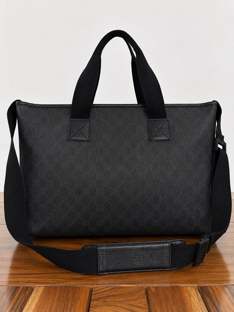 Gucci Tote GG Monogram (Category: Luxury Bags & Wallets) located in Paranaque City. Submitted by katlouieleandicho (Listing ID 1464594428, Image 3). Description: 💯Authentic Made in Italy Dimensions : W 20.5 in x H 12in x D 6.5in Gucci Black GG Canvas Tote Bag Classic Gucci tote in black GG monogram canvas with tonal leather detailing and sturdy webbing handles. Features a detachable adjustable shoulder strap with padded leather shoulder section,