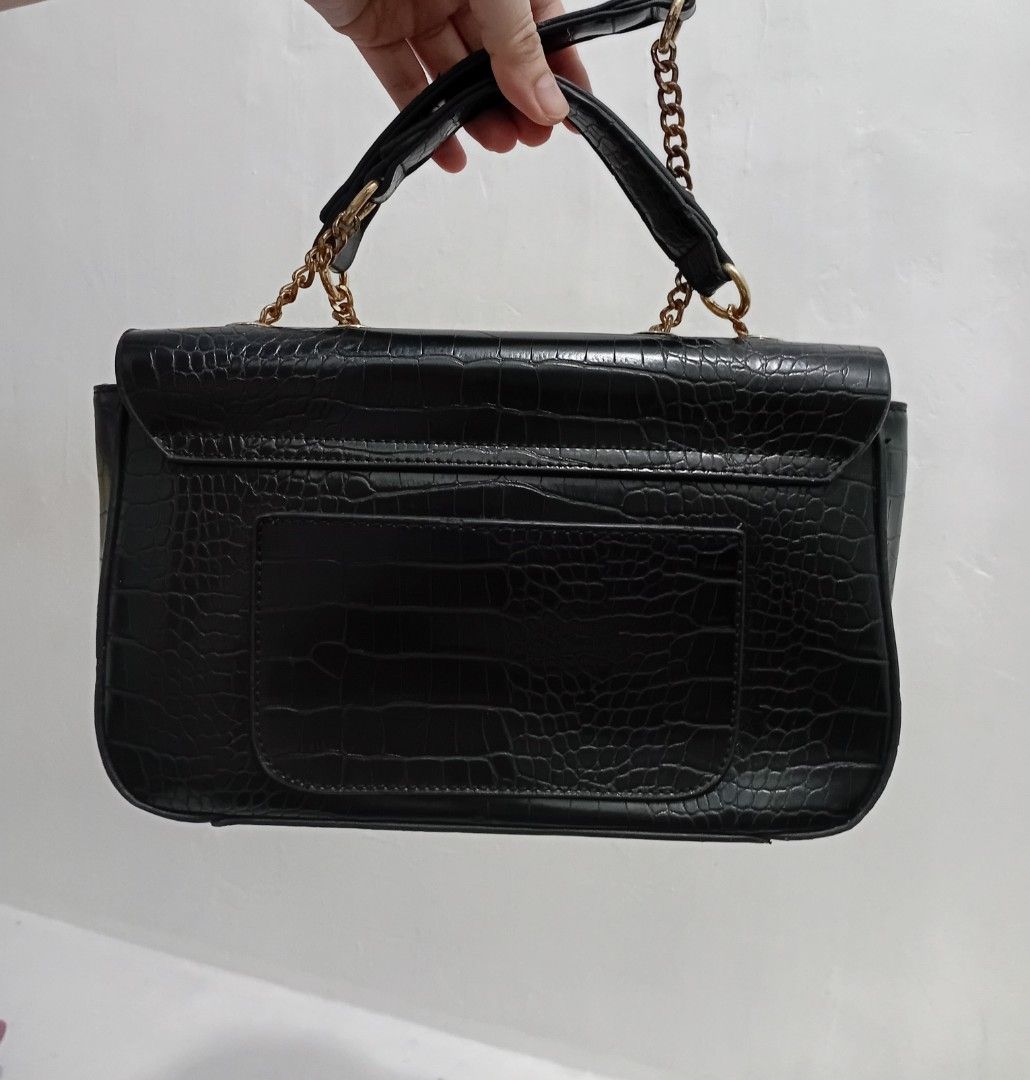 Guess Black Croc-Embossed Handbag with Gold Hardware (Category: Luxury Bags & Wallets) located in Manila. Submitted by kieerrrand52852 (Listing ID 1464709605, Image 3). Description: PreOwned Lightly Used Authentic Guess Croc Skin Leather Shoulder bag black Small - Color: Classic Black with a luxurious croc-embossed texture - Hardware: Elegant gold-toned details and chain strap - Closure: Flap closure featuring the iconic circular Guess logo - Sto