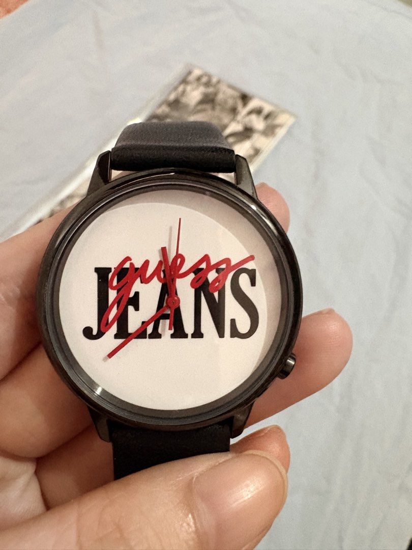 Guess Jeans Watch Black Leather Strap (Category: Women's Watches) located in Tanza. Submitted by abi_blanca (Listing ID 1464594862, Image 3). Description: - Cool Guess Jeans watch - Black genuine leather strap - White face with red and black logo - Back details: 'Guess Originals', 'Stainless Steel Japan Mov't', 'Water Resistant' - Model: V1022M2 - Includes original Guess packaging.