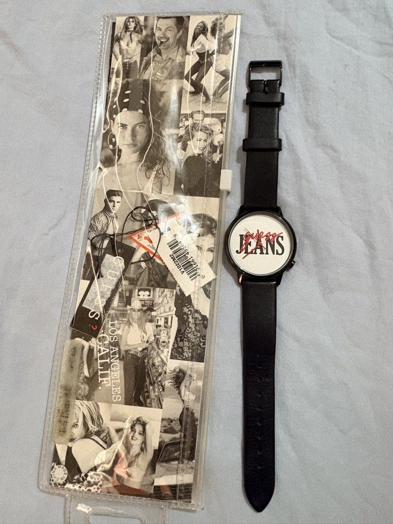Guess Jeans Watch Black Leather Strap (Category: Women's Watches) located in Tanza. Submitted by abi_blanca (Listing ID 1464594862, Image 2). Description: - Cool Guess Jeans watch - Black genuine leather strap - White face with red and black logo - Back details: 'Guess Originals', 'Stainless Steel Japan Mov't', 'Water Resistant' - Model: V1022M2 - Includes original Guess packaging.