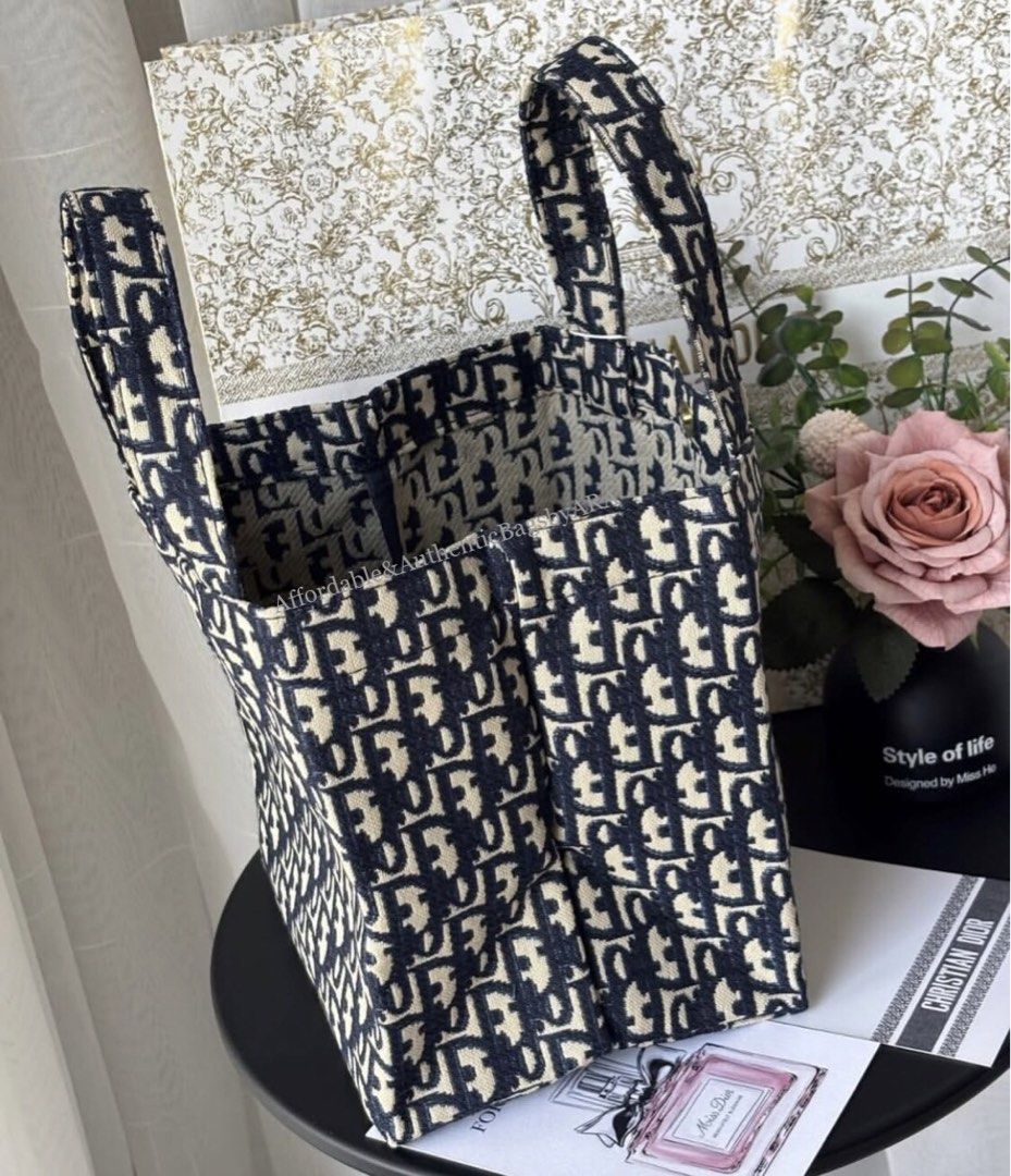 GWP DIOR OBLIQUE JACQUARED TOTE BAG BLUE (Category: Tote Bags) located in Daet. Submitted by ecassenluxuries (Listing ID 1464765055, Image 2). Description: 📌 FIXED PRICE ALREADY ✅ All items are guaranteed 💯% AUTHENTIC GWP ITEM ▫️Iconic blue and beige Dior Oblique jacquard canvas ▫️Trendy structured vertical silhouette ▫️Comfortable dual top handles for easy carrying ▫️Spacious open-top interior for all your daily essentials ▫️Durable fabric wit