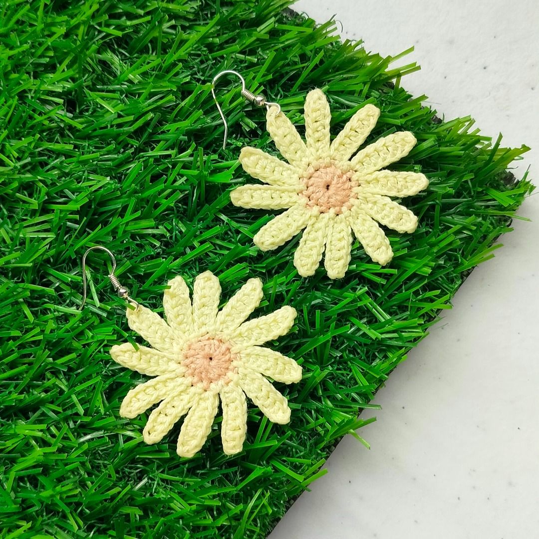 Handmade Crochet Daisy Flower Earrings Yellow (Category: Earrings) located in Calamba. Submitted by kedinizin_ip (Listing ID 1464596544, Image 2). Description: - Handmade crochet daisy earrings - Yellow petals with a light pink center - Adds a pop of color to any outfit - Lightweight and comfortable for all-day wear - Versatile for casual or special occasions - Unique accessory - What you see is what you get.