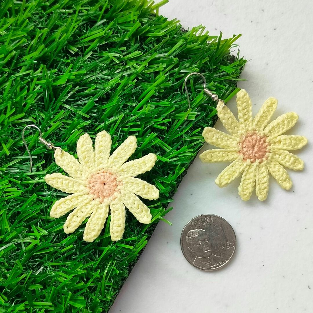 Handmade Crochet Daisy Flower Earrings Yellow (Category: Earrings) located in Calamba. Submitted by kedinizin_ip (Listing ID 1464596544, Image 1). Description: - Handmade crochet daisy earrings - Yellow petals with a light pink center - Adds a pop of color to any outfit - Lightweight and comfortable for all-day wear - Versatile for casual or special occasions - Unique accessory - What you see is what you get.