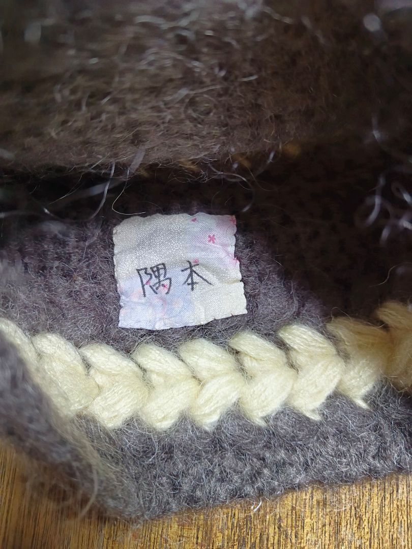 Handmade Knit Beanie Hat - Dark Grey & Cream (Category: Hats & Beanies) located in Mandaluyong City. Submitted by heatgear (Listing ID 1462834095, Image 2). Description: - Cozy knit beanie - Dark grey base with cream braided accents - Inner tag features Japanese writing - Ideal for keeping warm width 10 inches .