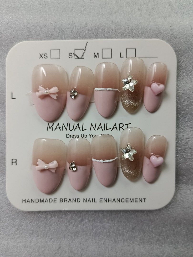 Handmade Press-On Nails Rhinestone Crystal Glam Set (Category: Hands & Nails) located in Manila. Submitted by thebossbabe (Listing ID 1464755835, Image 3). Description: Handmade press-on nail art set on display card. Includes 10 individual nails with detailed rhinestone and crystal embellishments over a nude and glitter gradient base. Size S indicated on the packaging. Ready to apply with adhesive tabs or glue. Great for parties, events, or every