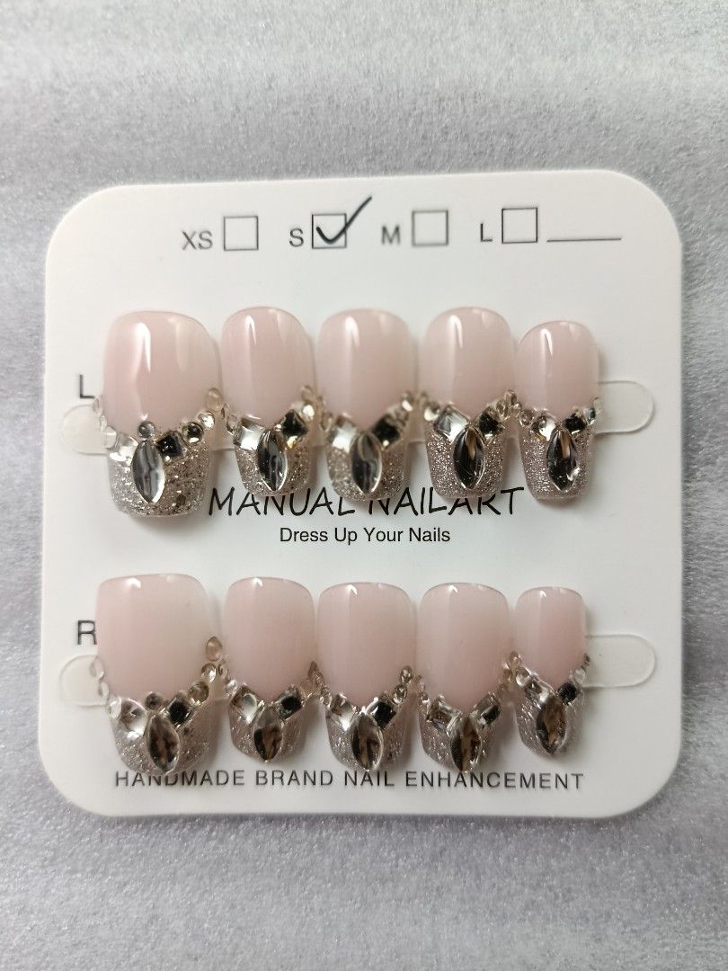 Handmade Press-On Nails Rhinestone Crystal Glam Set (Category: Hands & Nails) located in Manila. Submitted by thebossbabe (Listing ID 1464755835, Image 1). Description: Handmade press-on nail art set on display card. Includes 10 individual nails with detailed rhinestone and crystal embellishments over a nude and glitter gradient base. Size S indicated on the packaging. Ready to apply with adhesive tabs or glue. Great for parties, events, or every