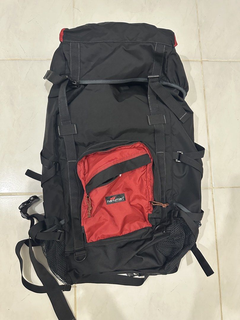 Hanuman Black Hiking Backpack 60L (Category: Backpacks) located in Baguio. Submitted by surplusbaguio.shop (Listing ID 1464622971, Image 1). Description: - Durable black hiking backpack - Eye-catching red front pocket - Multiple straps and buckles for secure gear attachment - Convenient side mesh pockets for water bottles or quick access items - Ample interior space for all your essentials - Ideal for camping, trekking, or travel - Ready for your