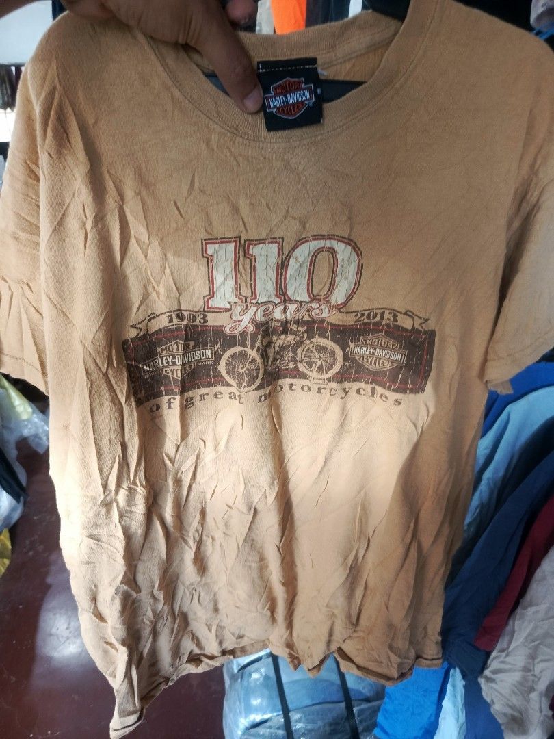 Harley-Davidson 110th Anniversary T-Shirt (Category: Tshirts & Polo Shirts ) located in Cabatuan. Submitted by penthegreat (Listing ID 1464607377, Image 1). Description: - Orange Harley-Davidson T-Shirt - Celebrates 110 Years of Harley-Davidson Motorcycles - Features Thunder Tower Harley-Davidson, Columbia, SC - Made of 100% Cotton - Size: Medium - Ideal for any Harley enthusiast.