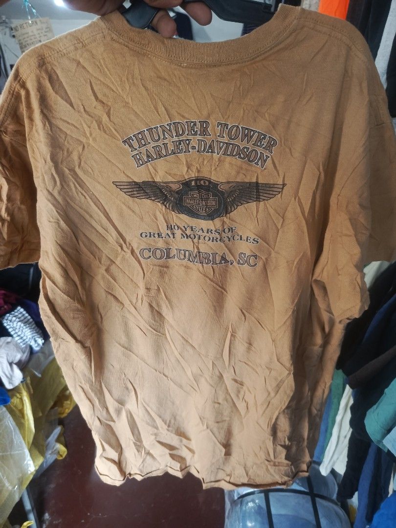 Harley-Davidson 110th Anniversary T-Shirt (Category: Tshirts & Polo Shirts ) located in Cabatuan. Submitted by penthegreat (Listing ID 1464607377, Image 2). Description: - Orange Harley-Davidson T-Shirt - Celebrates 110 Years of Harley-Davidson Motorcycles - Features Thunder Tower Harley-Davidson, Columbia, SC - Made of 100% Cotton - Size: Medium - Ideal for any Harley enthusiast.