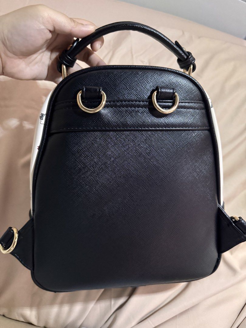 Hello Kitty Black and White Mini Backpack (Category: Backpacks) located in Muntinlupa City. Submitted by mimitatsboutique (Listing ID 1464717356, Image 2). Description: - Authentic Hello Kitty mini backpack - Premium gold-tone hardware - Has lot of compartments inside, spacious.