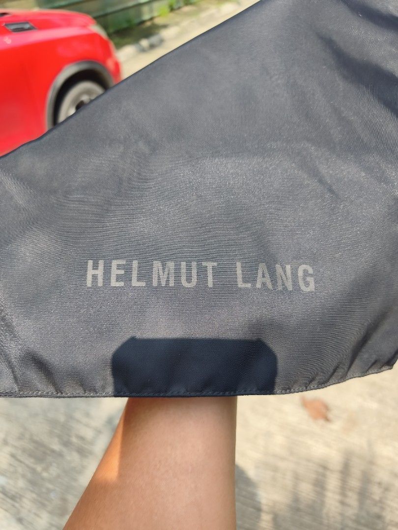 Helmut Lang Black RectangleTote Bag (Category: Tote Bags) located in Bulacan. Submitted by THA_D_THRIFT (Listing ID 1464583485, Image 2). Description: - Authentic Helmut Lang black canvas tote bag - Chic and simple design - Unique cut-out handle detail - Spacious interior, ideal for everyday essentials - Versatile for work, errands, or casual outings 8K OR BEST OFFER.