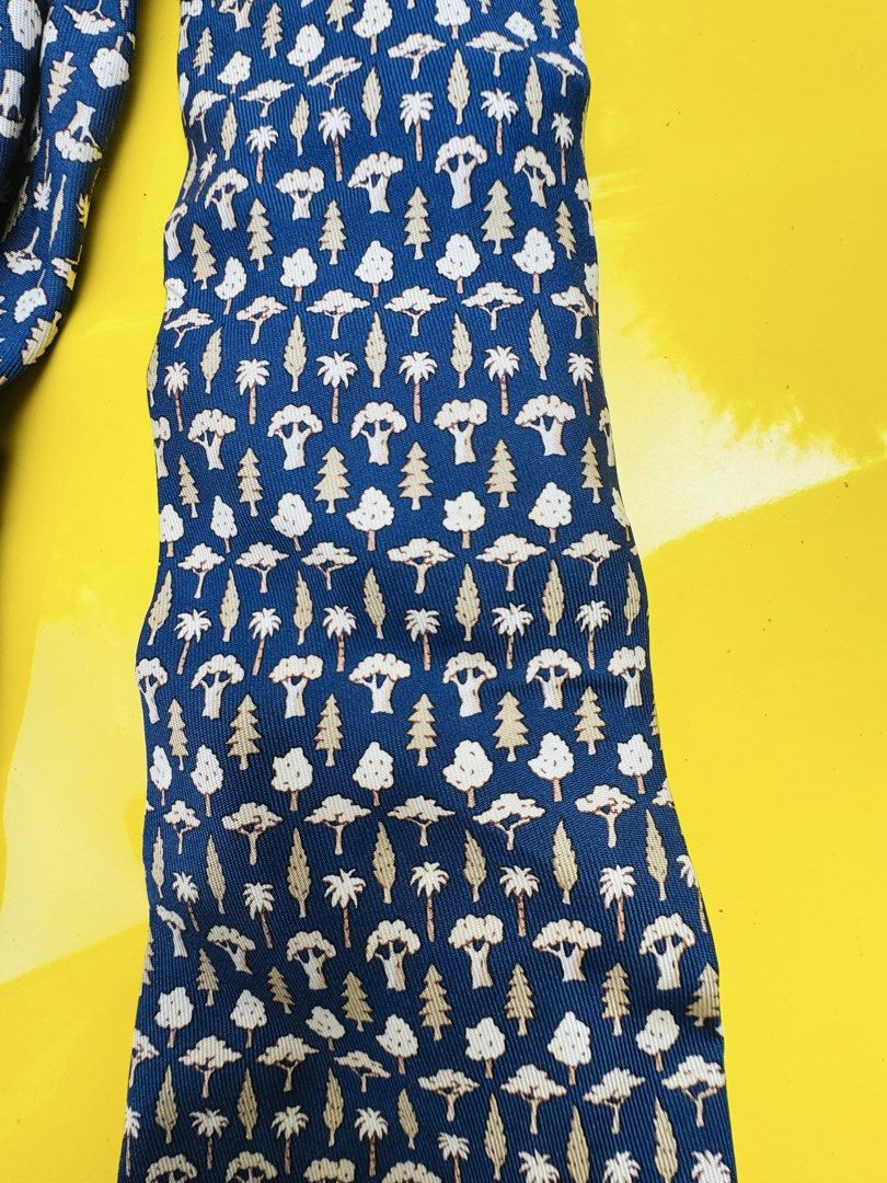Hermes Paris 100% Silk Tie - Tree Pattern (Category: Ties) located in Santa Cruz. Submitted by maqui15 (Listing ID 1464586133, Image 2). Description: - Authentic Hermes tie - 100% Silk - Color: Navy blue base - Pattern: Repeating trees and clouds in beige and white - Care: Dry clean only - Style: Classic accessory, great for dressing up an outfit -this is from japan bidding .