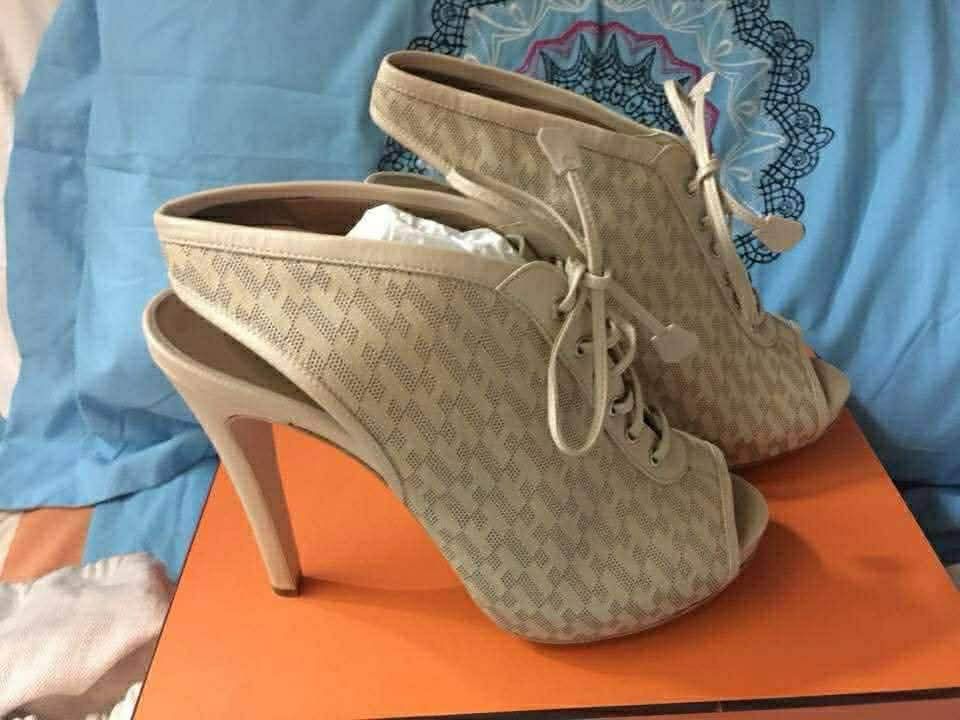 Hermès Peep-Toe Lace-Up Slingback Booties (Category: Heels) located in San Juan City. Submitted by erikacastanedaaaa27 (Listing ID 1464746668, Image 2). Description: NEGOTIABLE! Details: • Brand: Hermès • Color: Beige / Ecru • Material: Canvas & Leather • Style: Peep-toe lace-up slingback booties • Heel: High stiletto • Made in Italy Condition: Excellent condition. Only used once for a party. Comes with original box, original dust bag, and origin