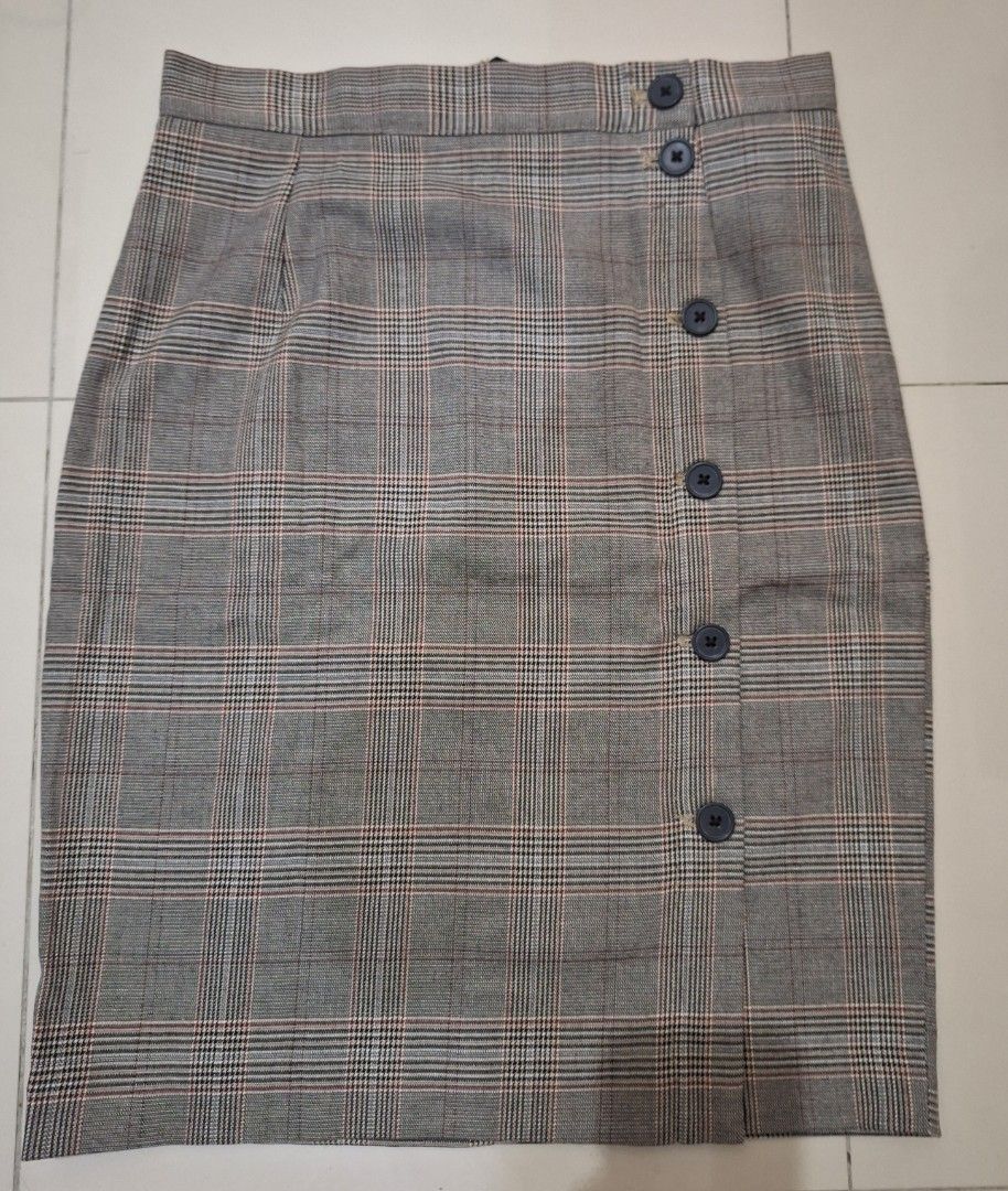 H&M Plaid Button Front Pencil Skirt with slit (Category: Skirts) located in Makati City. Submitted by worn2work_treasures (Listing ID 1464618067, Image 1). Description: - Grey plaid pencil skirt - Brand: H&M - Features button front detail - Knee length - Perfect for work or casual outings - Can be dressed up or down Length from waist - 21.5 inches or 55.5 cm Hips - 18 inches Composition: Polyester, Viscose, Elastin .