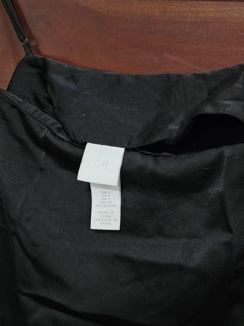 H&M silk black dress (Category: Dresses) located in Los Banos. Submitted by itsmecathey (Listing ID 1464753277, Image 2). Description: Super nice, can fit S-M.