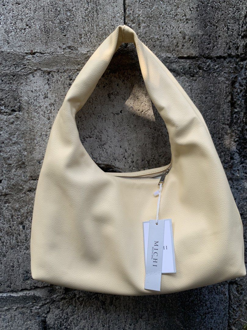 Hobo Bag (Category: Shoulder Bags) located in Bayombong. Submitted by declutterbyriri (Listing ID 1464651620, Image 2). Description: HOBO BAG SOLD AS SET 💛❤️ MICHI in butter yellow - medium size - still have tag on it MUMUSELECT in burgundy - small size - FREE.