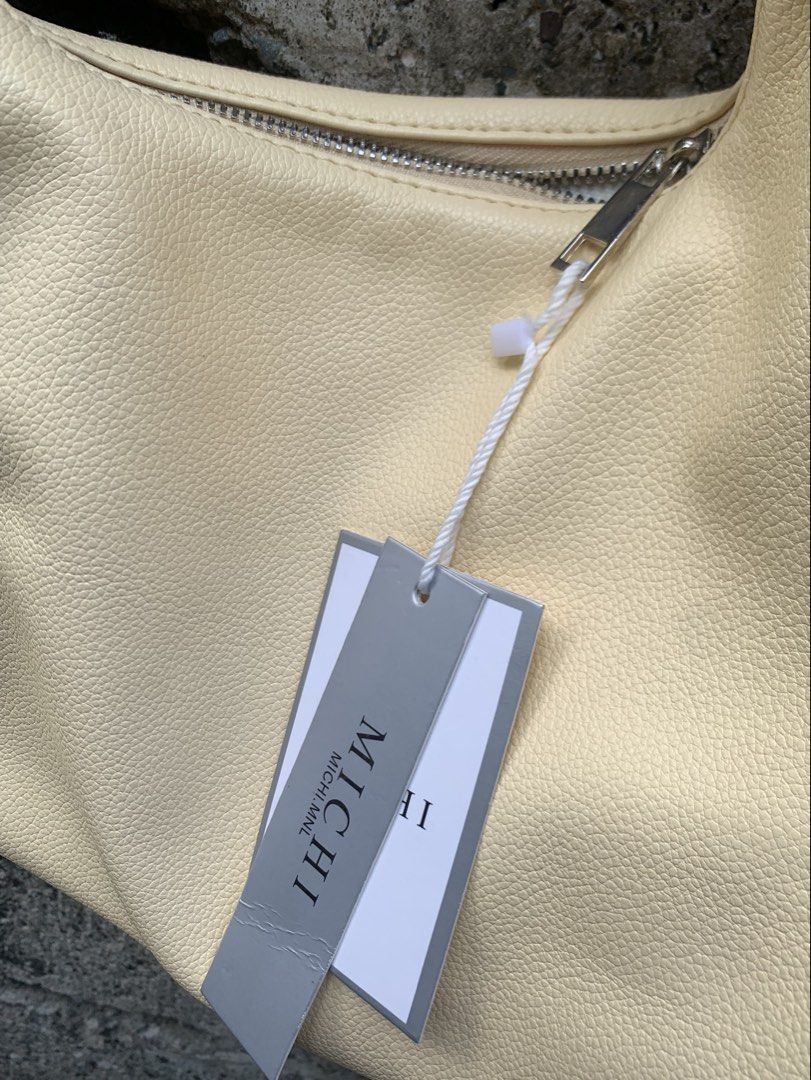 Hobo Bag (Category: Shoulder Bags) located in Bayombong. Submitted by declutterbyriri (Listing ID 1464651620, Image 3). Description: HOBO BAG SOLD AS SET 💛❤️ MICHI in butter yellow - medium size - still have tag on it MUMUSELECT in burgundy - small size - FREE.